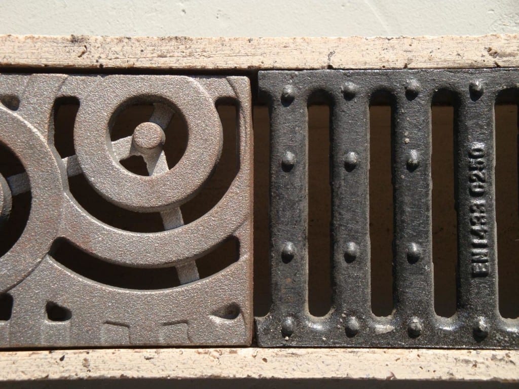 polymer concrete trench drain, cast iron grates, decorative cast iron grate, slotted cast iron grating